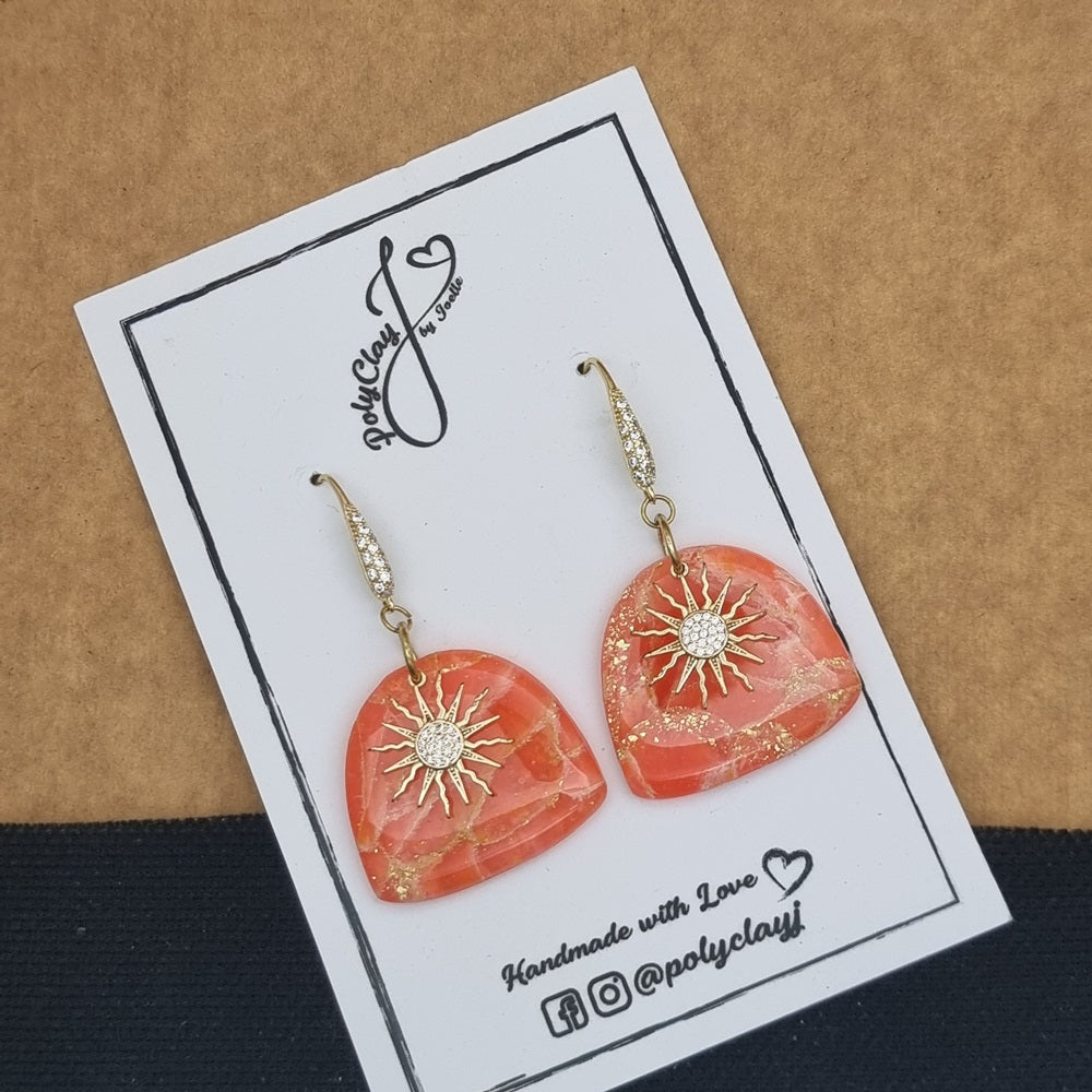 Fiery orange marble arch dangles with zircon sun pendant (Gold)