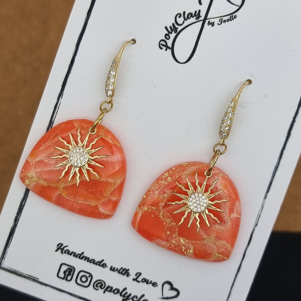 Fiery orange marble arch dangles with zircon sun pendant (Gold)